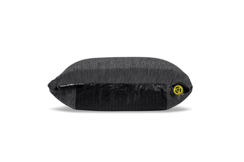 Side view of a highly inflated hybrid camping pillow