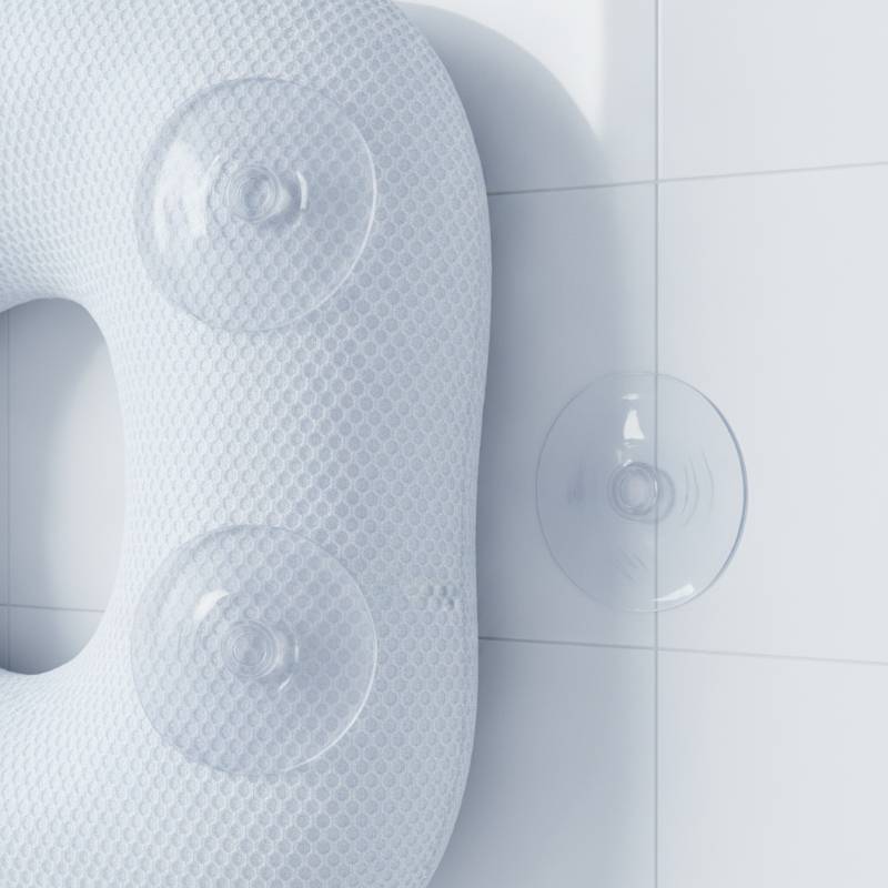Close-up of 3D air mesh fabric on a bath pillow showing breathable layers and suction cups